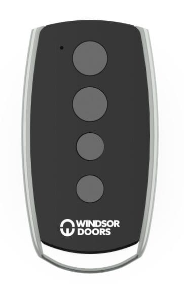 A Windsor Doors RC02 four-button garage door remote