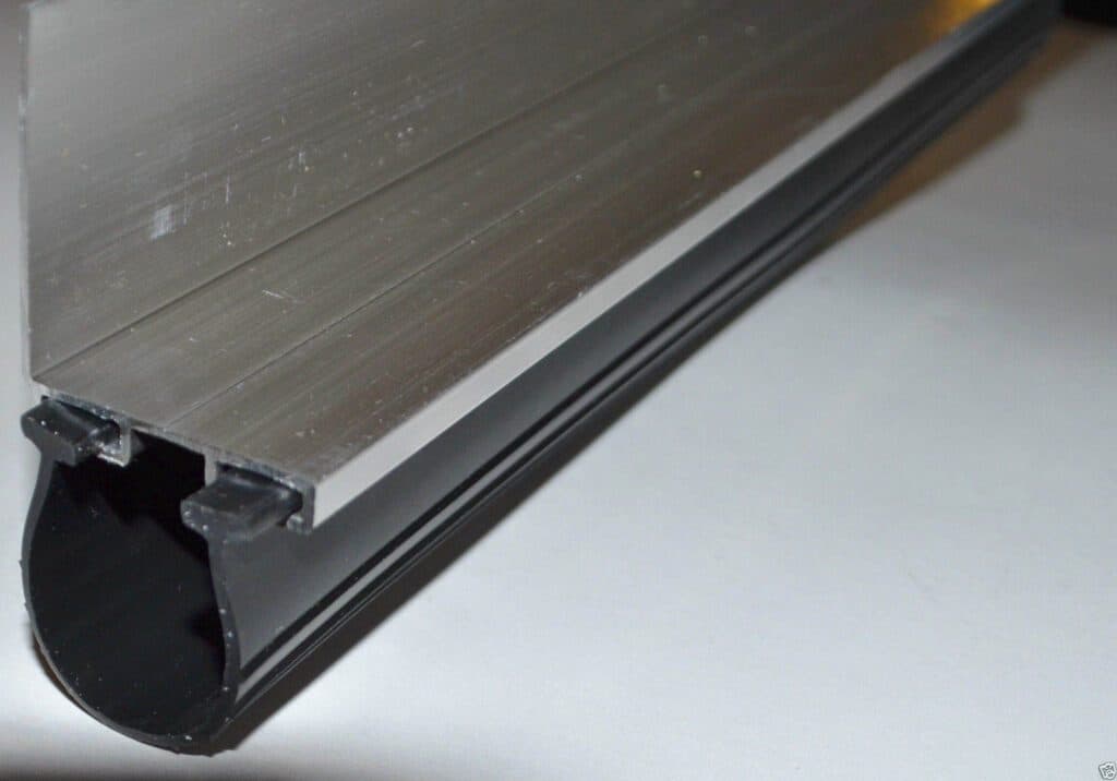 An aluminium seal carrier with the rubber weather seal fitted into it