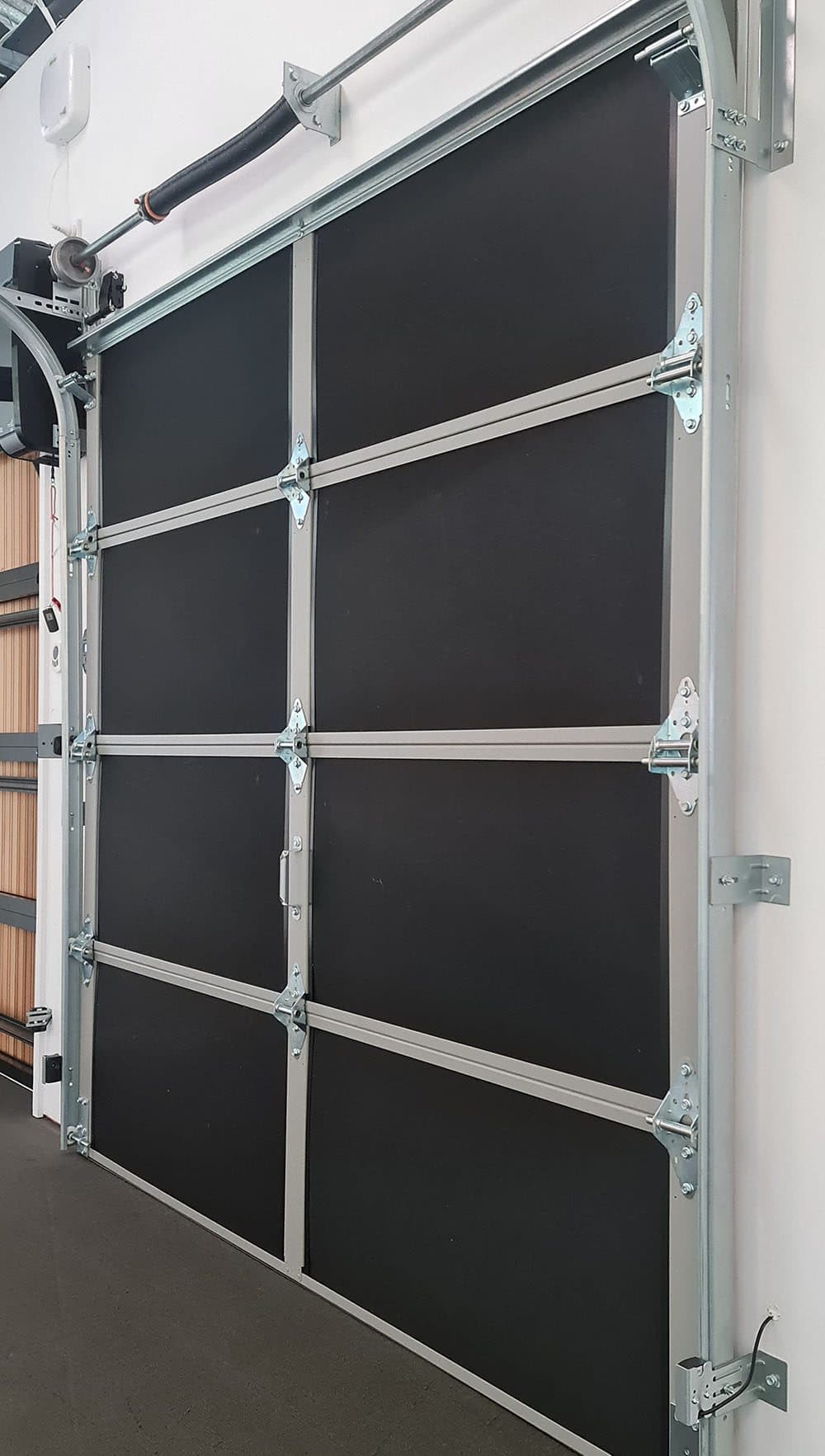 Autex insulation fitted to the back of a sectional garage door panel